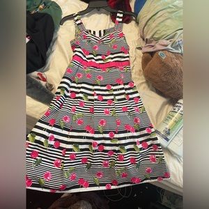 Children’s cherry dress. Size s/m. Has a zipper bag and hangs at the knees